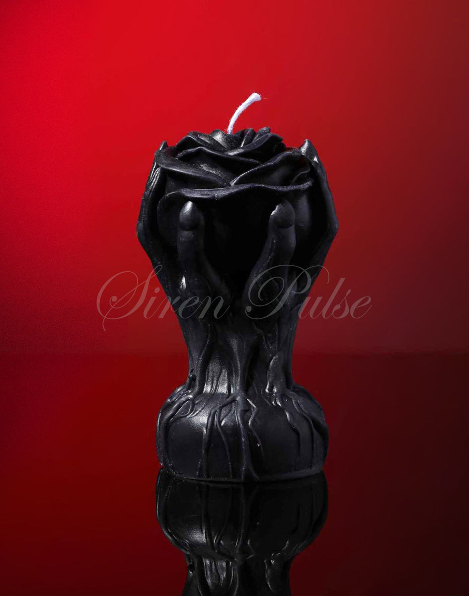 Black rose-shaped BDSM wax play candle by Siren Pulse – low temperature drip rose sex toy sculpted in hands for erotic ritual and sensory control