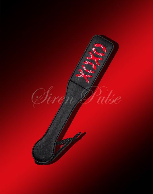 Siren Pulse spanking paddle crafted for impact play and BDSM sessions. Ideal for exploring spanking paddle techniques, BDSM cane styles, and BDSM sex stories.