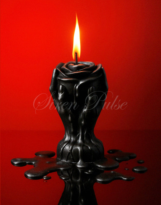 Black rose-shaped BDSM wax play candle by Siren Pulse – low temperature drip rose sex toy sculpted in hands for erotic ritual and sensory control