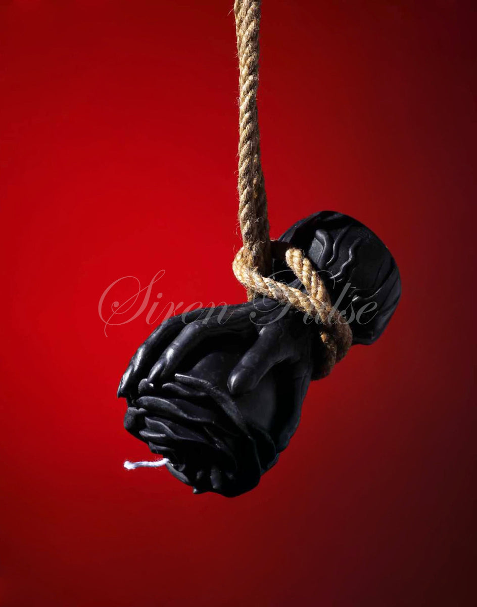 Black rose-shaped BDSM wax play candle by Siren Pulse – low temperature drip rose sex toy sculpted in hands for erotic ritual and sensory control